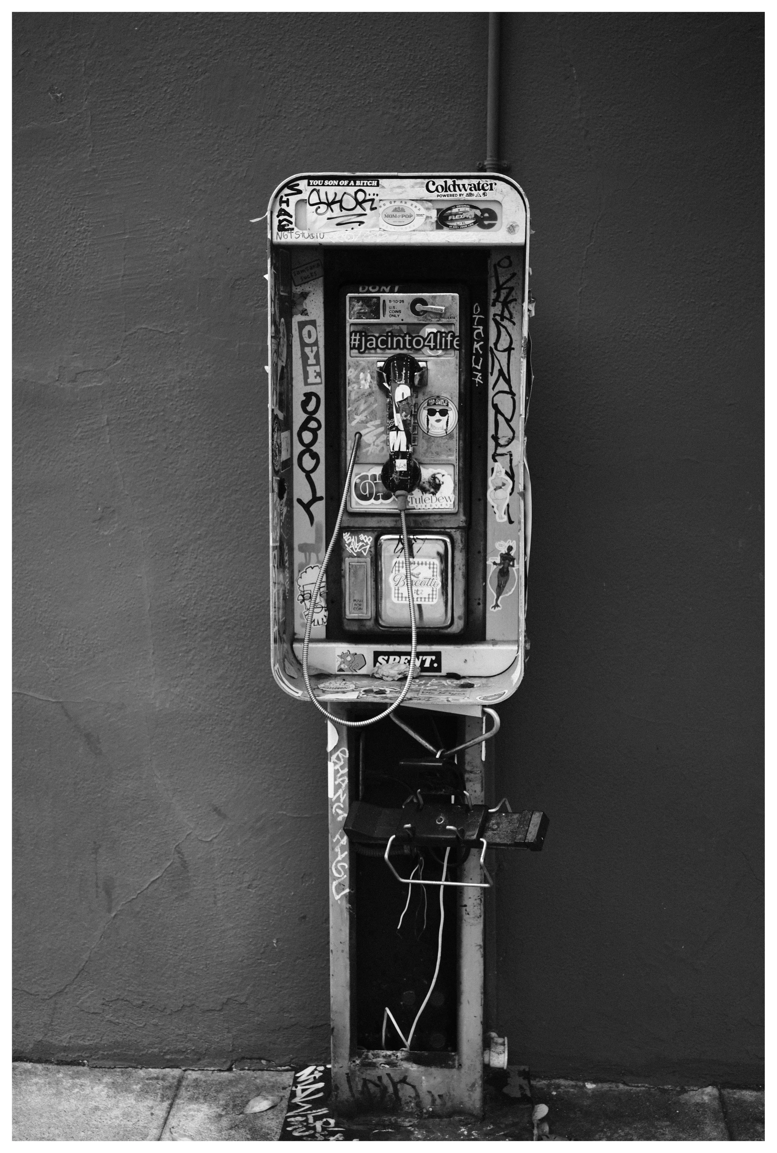An old school telephone with art on it