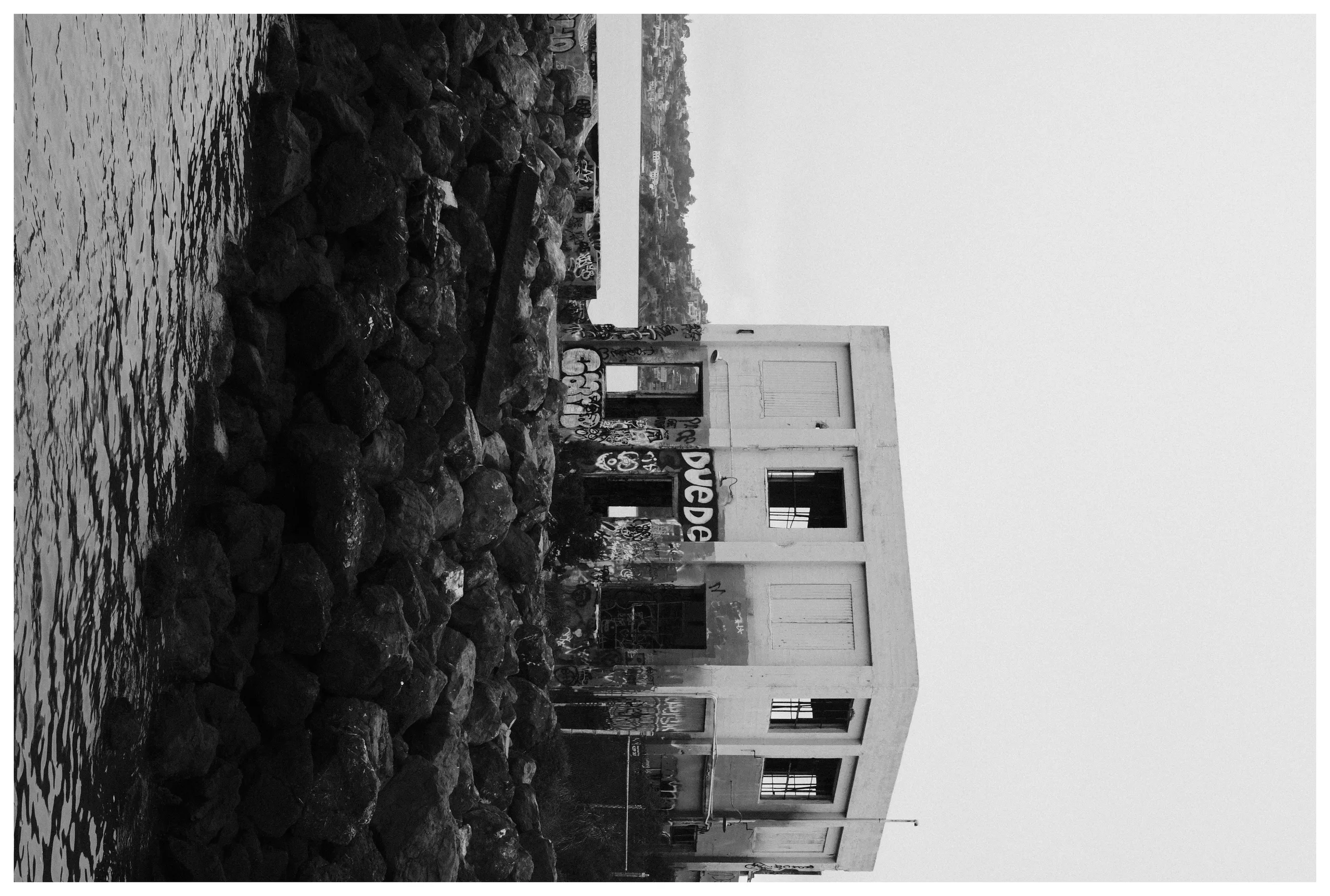 An old building in black and white with duede drawn on it